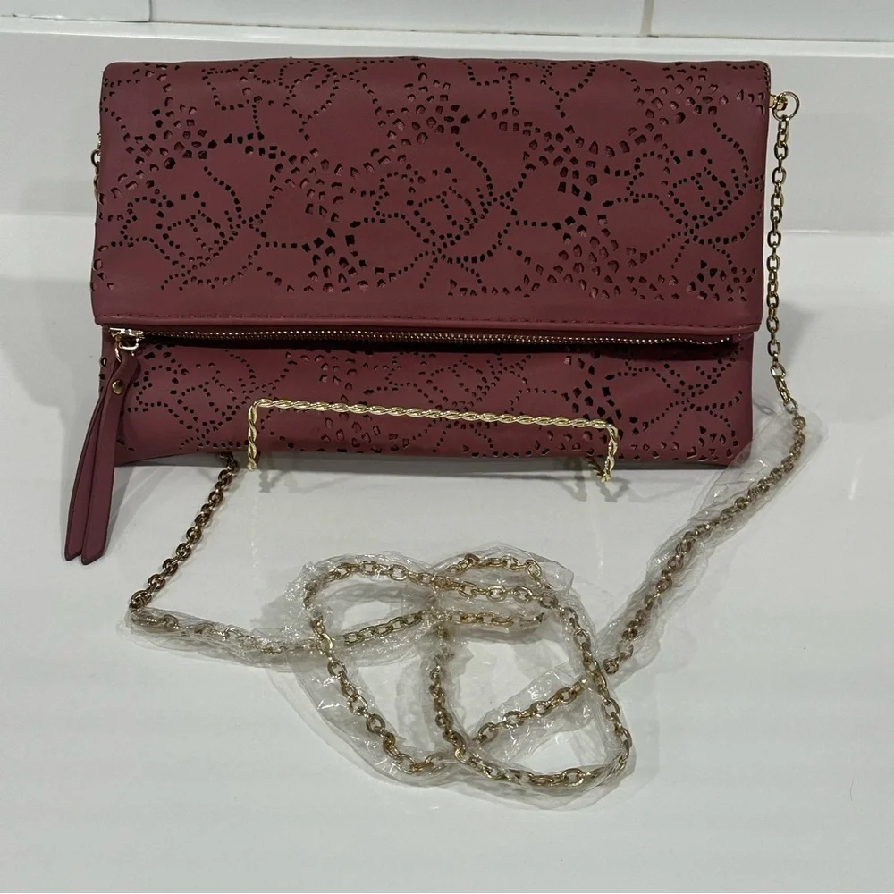 Urban Expressions Pink Laser Cut “Locket” Clutch. New without tags